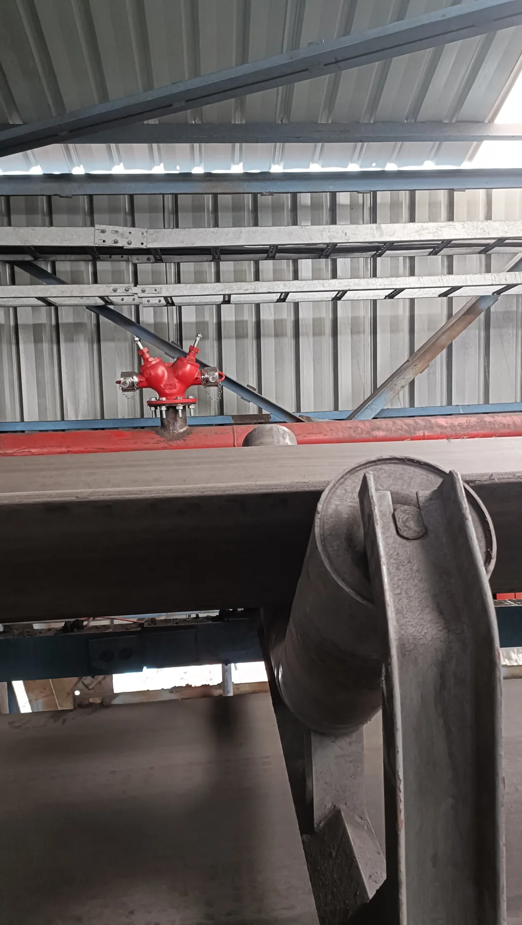 Overhead fire hydrant valve installed on industrial pipe riser