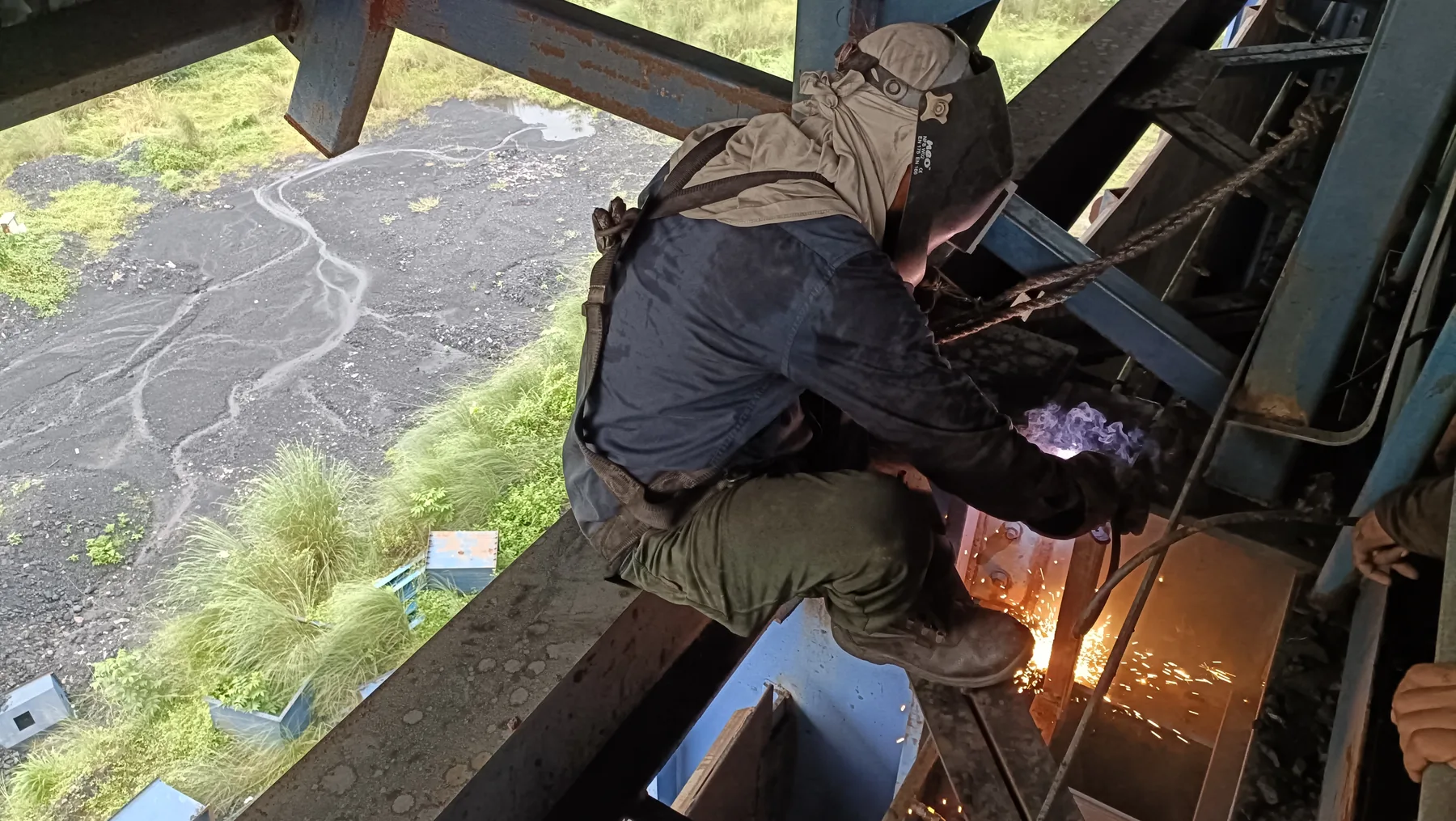 Ignispin technician carrying out site installation work at height